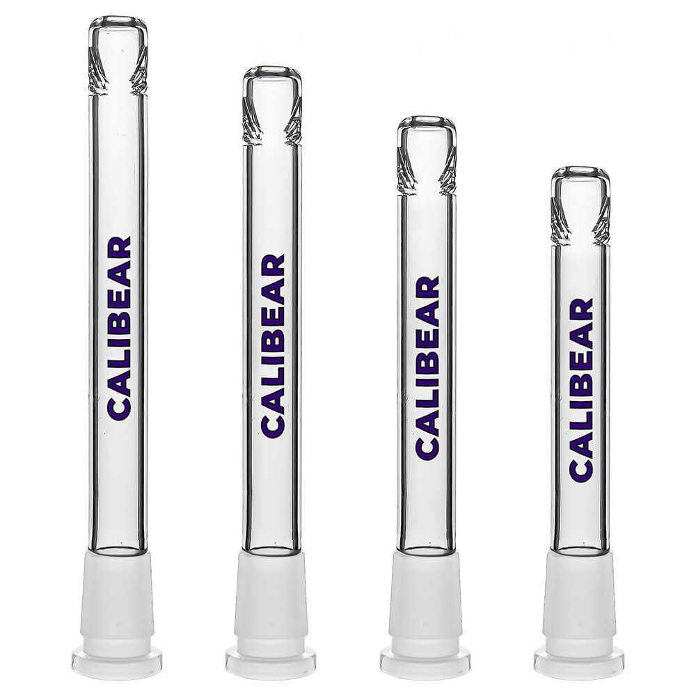Four clear glass Dank Banger Premium Tri-Seed Slotted Ice Pinch Downstems in varying lengths, showcasing the unique triangular ice pinch restriction at the tip and clear embossed side logos.